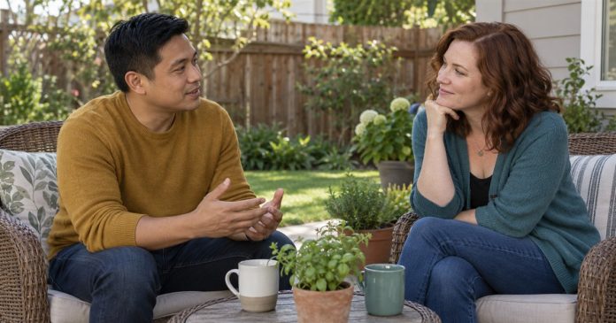A couple talking attentively in separate chairs on a home backyard patio