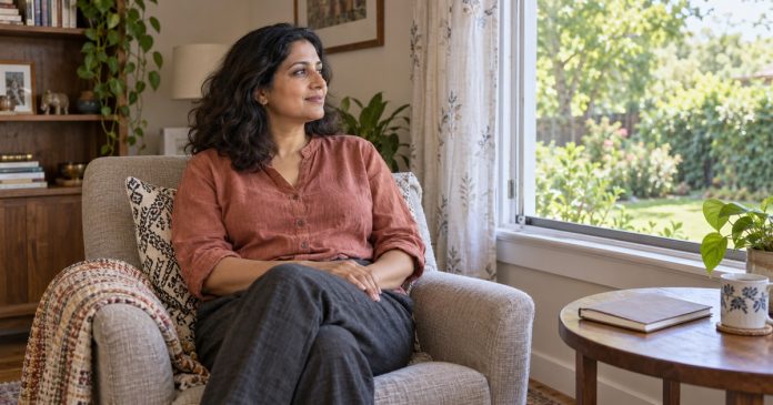 Mantra quiet home pause cover A woman taking a quiet pause in an armchair beside a window at home